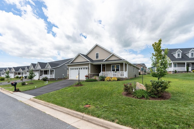 133 Lake View Cir, Waynesboro, VA 22980 - view of front of home with asphalt driveway, covered porch, board and batten siding, an attached garage, and a front lawn