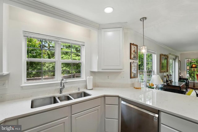 kitchen with dishwasher, a sink, ornamental molding, white cabinetry, and hanging light fixtures