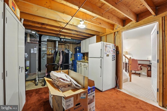 unfinished below grade area featuring freestanding refrigerator, carpet floors, and wooden ceiling