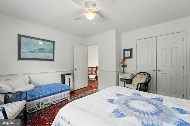 bedroom featuring a closet, a ceiling fan, and wood finished floors