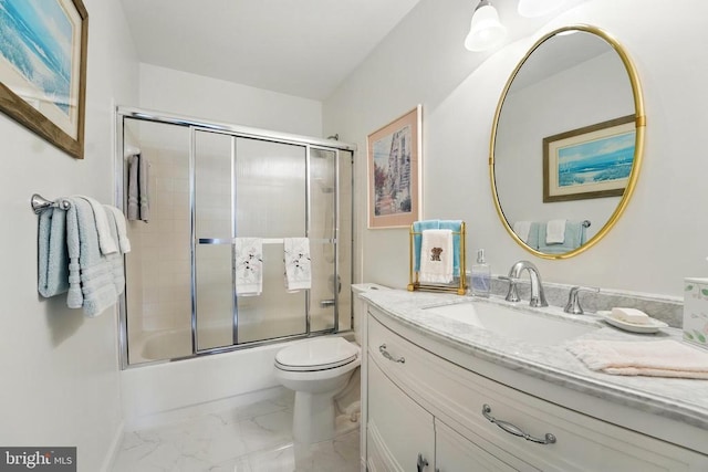full bathroom with marble finish floors, toilet, vanity, and shower / bath combination with glass door
