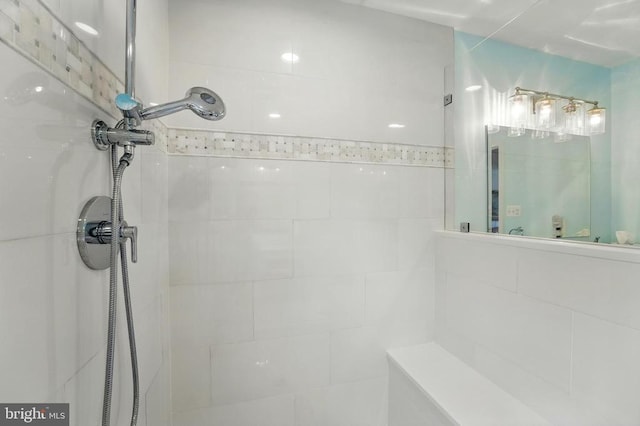 bathroom with a tile shower