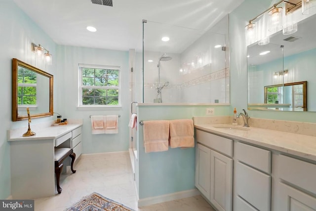 bathroom featuring a shower stall, baseboards, marble look tiles, vanity, and recessed lighting