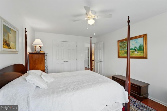 bedroom featuring wood finished floors, a closet, baseboards, and a ceiling fan