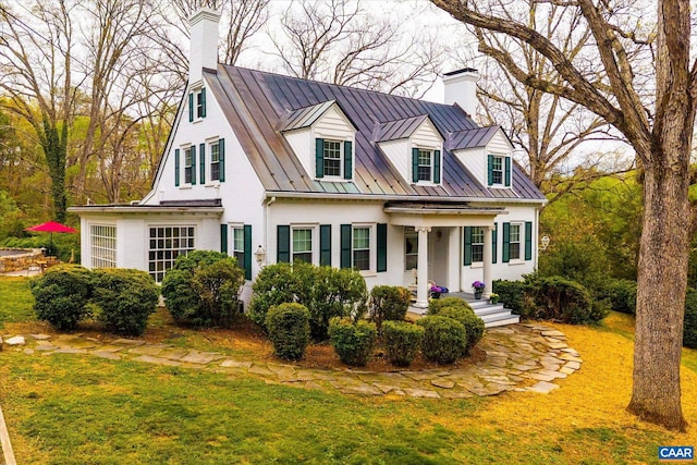 3220 Longdale Furnace Rd, Clifton Forge, VA 24422 - cape cod-style house featuring a standing seam roof, a chimney, metal roof, a front yard, and stucco siding