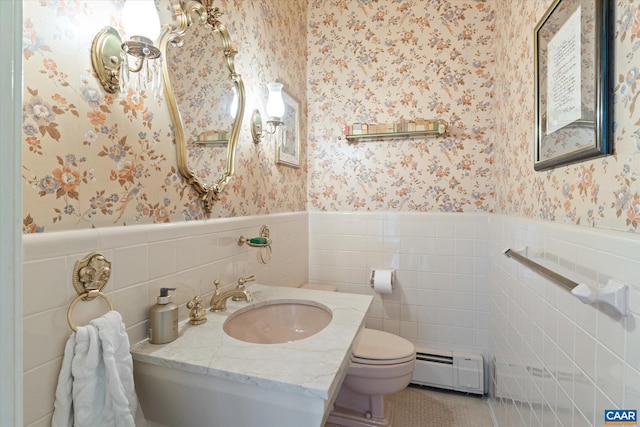 3220 Longdale Furnace Rd, Clifton Forge, VA 24422 - bathroom with a baseboard radiator, wallpapered walls, toilet, a wainscoted wall, and tile walls