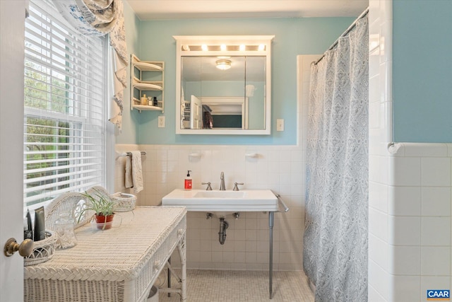 3220 Longdale Furnace Rd, Clifton Forge, VA 24422 - bathroom with tile walls, a wainscoted wall, a shower with curtain, and tile patterned flooring