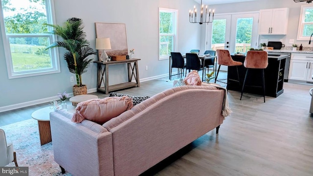 176 Tussing Ln, Rochelle, VA 22738 - living area with light wood-style floors, a chandelier, and baseboards