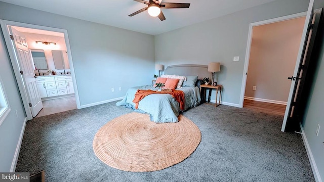 176 Tussing Ln, Rochelle, VA 22738 - carpeted bedroom with connected bathroom, baseboards, and ceiling fan