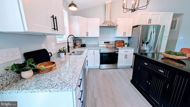 176 Tussing Ln, Rochelle, VA 22738 - kitchen with stainless steel appliances, wall chimney exhaust hood, a sink, white cabinetry, and light wood-type flooring