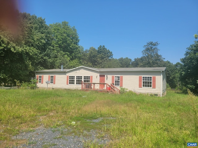 manufactured / mobile home with a wooden deck