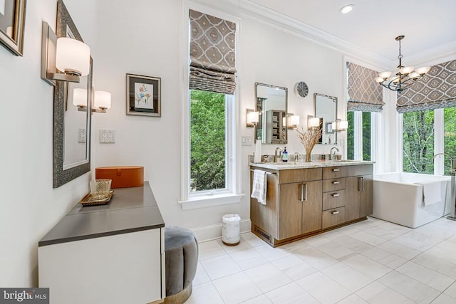 87 River Bend Rd E, Fredericksburg, VA 22407 - full bathroom featuring a freestanding tub, crown molding, a chandelier, double vanity, and healthy amount of natural light