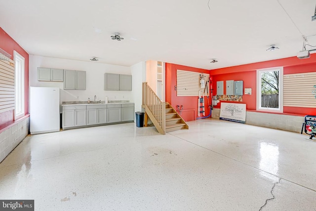 87 River Bend Rd E, Fredericksburg, VA 22407 - garage featuring freestanding refrigerator, a sink, a garage door opener, and electric panel