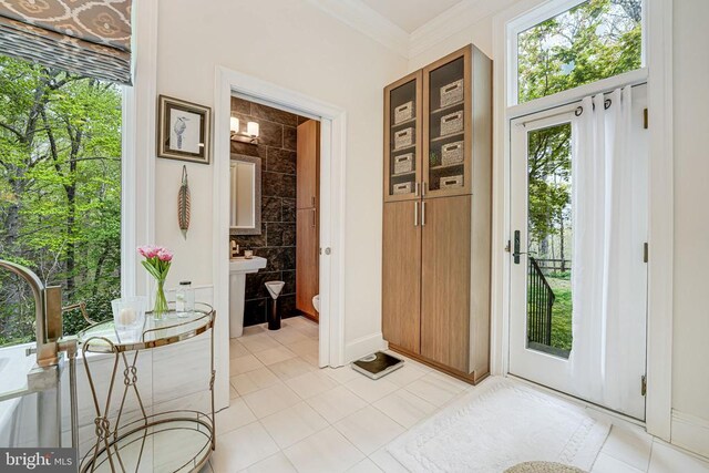 87 River Bend Rd E, Fredericksburg, VA 22407 - entryway with light tile patterned floors, crown molding, and baseboards