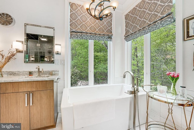 87 River Bend Rd E, Fredericksburg, VA 22407 - bathroom featuring a soaking tub, vanity, plenty of natural light, and a chandelier