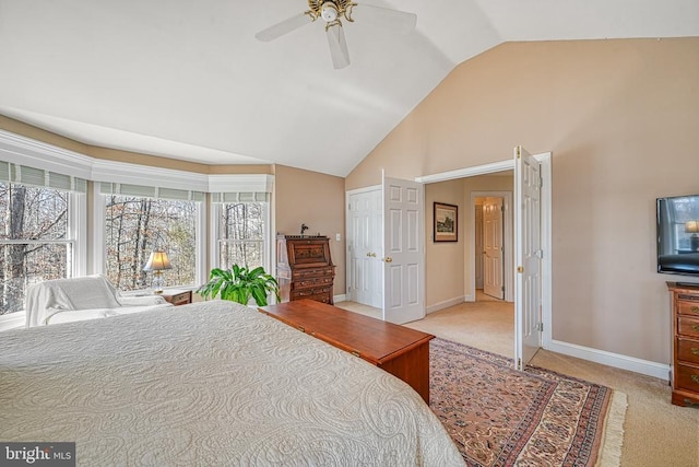 bedroom featuring baseboards, lofted ceiling, ceiling fan, and carpet floors