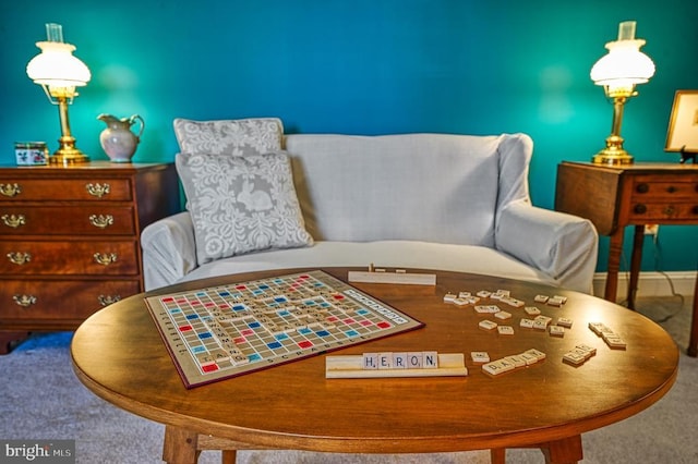sitting room featuring carpet flooring