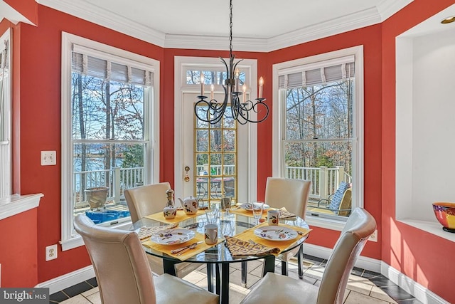 tiled dining area with crown molding, a notable chandelier, and baseboards
