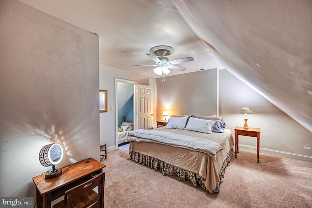 bedroom featuring carpet flooring, baseboards, lofted ceiling, and ceiling fan