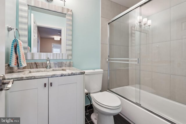6215 Hot Spring Ln, Fredericksburg, VA 22407 - bathroom featuring toilet, vanity, and shower / bath combination with glass door
