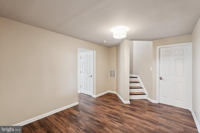 6215 Hot Spring Ln, Fredericksburg, VA 22407 - basement featuring dark wood-style flooring, baseboards, and stairway