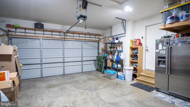 6215 Hot Spring Ln, Fredericksburg, VA 22407 - garage with stainless steel fridge with ice dispenser and a garage door opener