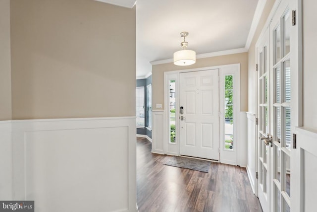 6215 Hot Spring Ln, Fredericksburg, VA 22407 - foyer entrance featuring ornamental molding, a wainscoted wall, wood finished floors, french doors, and a decorative wall