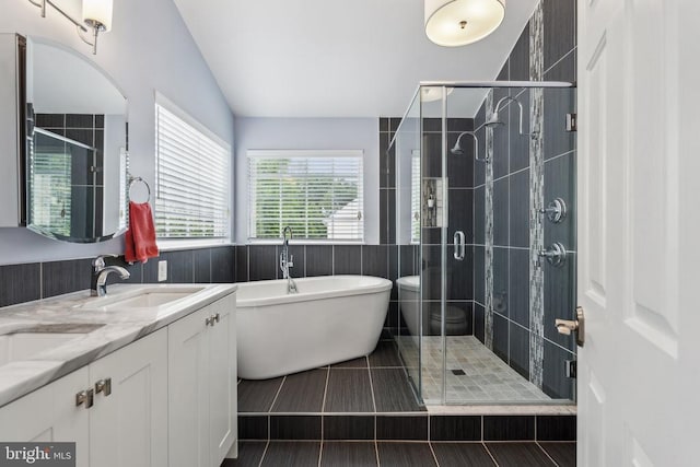 6215 Hot Spring Ln, Fredericksburg, VA 22407 - bathroom featuring a soaking tub, a stall shower, double vanity, and vaulted ceiling