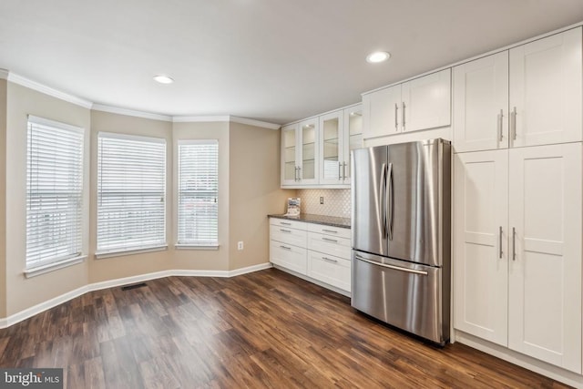 6215 Hot Spring Ln, Fredericksburg, VA 22407 - kitchen with freestanding refrigerator, baseboards, ornamental molding, glass insert cabinets, and healthy amount of natural light