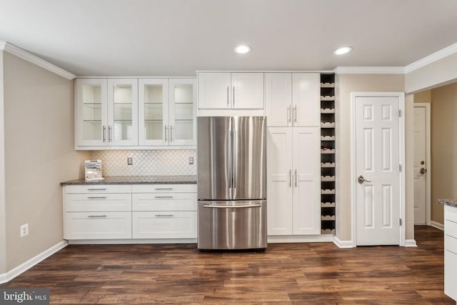 6215 Hot Spring Ln, Fredericksburg, VA 22407 - kitchen featuring freestanding refrigerator, crown molding, dark stone counters, white cabinets, and recessed lighting