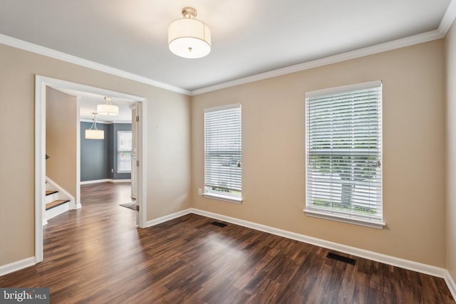 6215 Hot Spring Ln, Fredericksburg, VA 22407 - spare room featuring crown molding, dark wood-style flooring, baseboards, and stairway