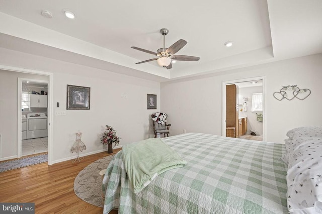 53 Arthur Ln, Luray, VA 22835 - bedroom with independent washer and dryer, wood finished floors, a raised ceiling, ensuite bath, and baseboards