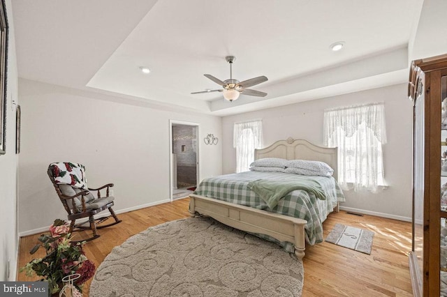 53 Arthur Ln, Luray, VA 22835 - bedroom featuring a tray ceiling, baseboards, light wood-style flooring, recessed lighting, and ceiling fan
