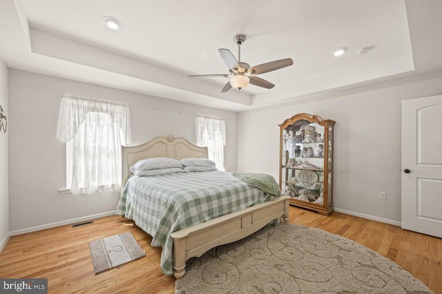 53 Arthur Ln, Luray, VA 22835 - bedroom featuring a tray ceiling, baseboards, wood finished floors, ceiling fan, and recessed lighting