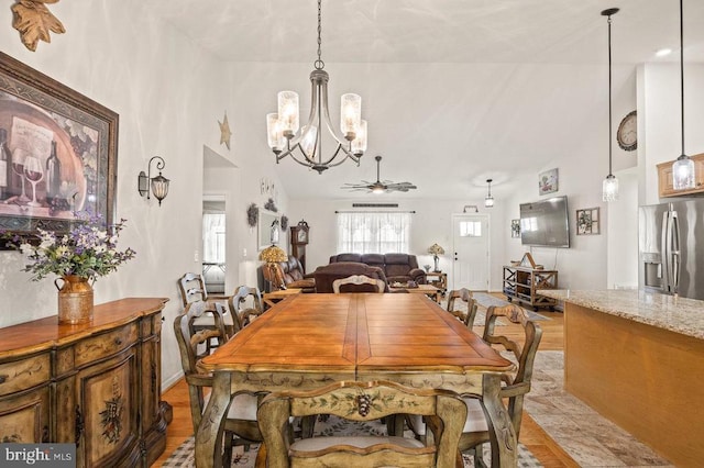 53 Arthur Ln, Luray, VA 22835 - dining room with a chandelier, ceiling fan, high vaulted ceiling, and light wood finished floors