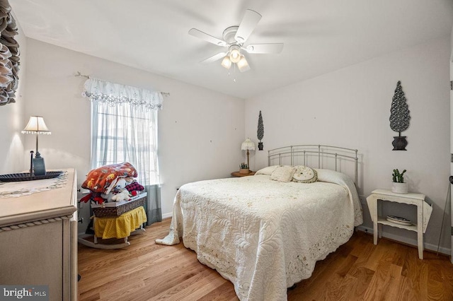 53 Arthur Ln, Luray, VA 22835 - bedroom featuring light wood-style floors, a ceiling fan, and baseboards