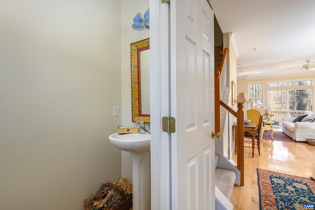 bathroom featuring wood finished floors and a ceiling fan