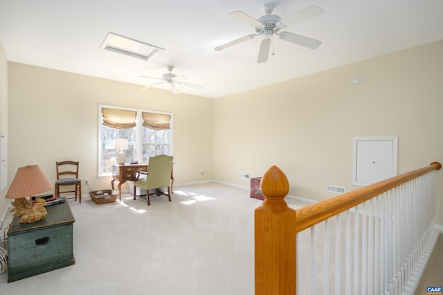 office with baseboards, visible vents, attic access, and light colored carpet