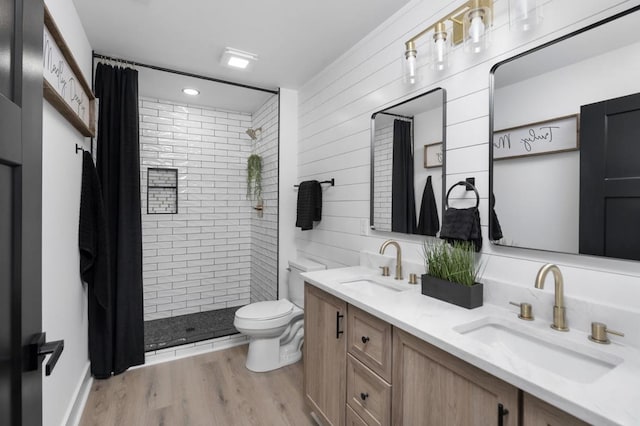 9 Walnut St, Fishersville, VA 22939 - full bath featuring a stall shower, toilet, double vanity, wood finished floors, and wooden walls