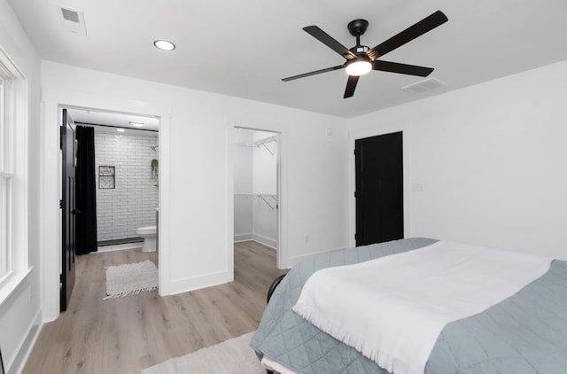 9 Walnut St, Fishersville, VA 22939 - bedroom featuring light wood-style floors, a spacious closet, ensuite bathroom, a closet, and baseboards