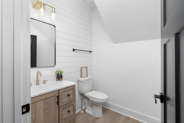 9 Walnut St, Fishersville, VA 22939 - bathroom featuring wood walls, toilet, wood finished floors, vanity, and lofted ceiling