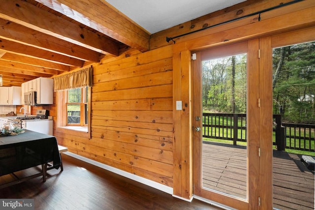 248 Wintergreen Dr, Luray, VA 22835 - kitchen featuring wood walls, dark wood-type flooring, beamed ceiling, stainless steel appliances, and white cabinets