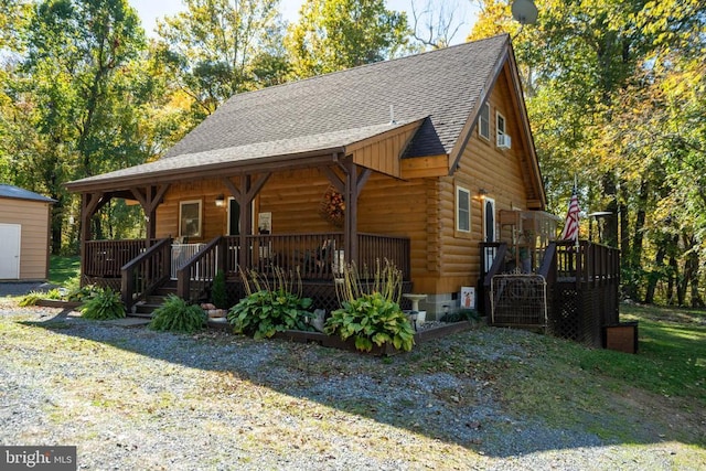 248 Wintergreen Dr, Luray, VA 22835 - view of front of home featuring covered porch, stairway, a shingled roof, and log exterior