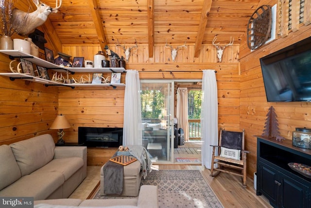 248 Wintergreen Dr, Luray, VA 22835 - living area featuring wooden ceiling, wood walls, wood finished floors, and lofted ceiling with beams