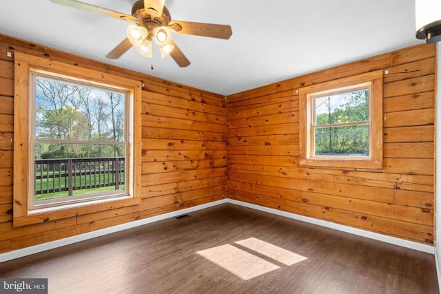 248 Wintergreen Dr, Luray, VA 22835 - unfurnished room featuring dark wood finished floors, visible vents, baseboards, and a ceiling fan