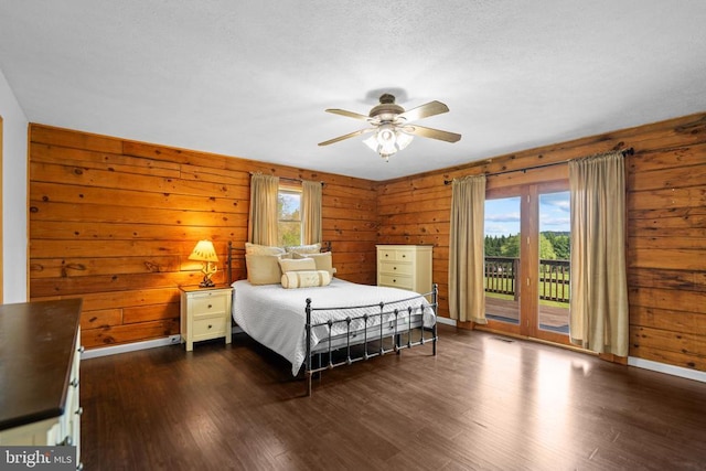 248 Wintergreen Dr, Luray, VA 22835 - bedroom featuring wooden walls, access to outside, and dark wood-style floors