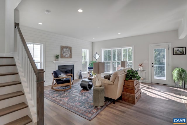 33 Ashlin Cv, Charlottesville, VA 22901 - living area featuring stairway, a glass covered fireplace, recessed lighting, and wood finished floors