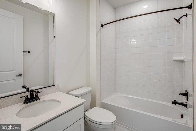 full bath featuring toilet, vanity, and bathing tub / shower combination