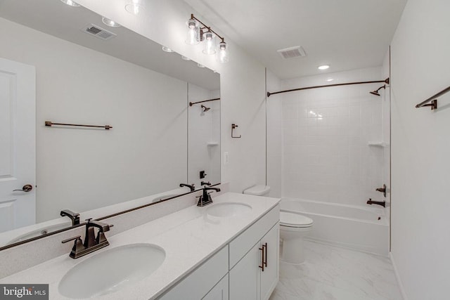 bathroom with toilet, double vanity, marble finish floors, bathing tub / shower combination, and recessed lighting