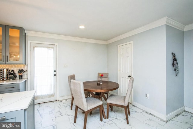 dining space with baseboards, marble finish floor, ornamental molding, and recessed lighting